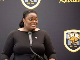 Tiffany Tucker speaking at podium