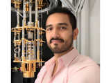 dr. suarez-forero standing in front of a machine