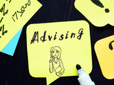 illustration of academic advisor on yellow sticky note with the word advising