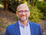Headshot of UMBC Professor Eric Stokan